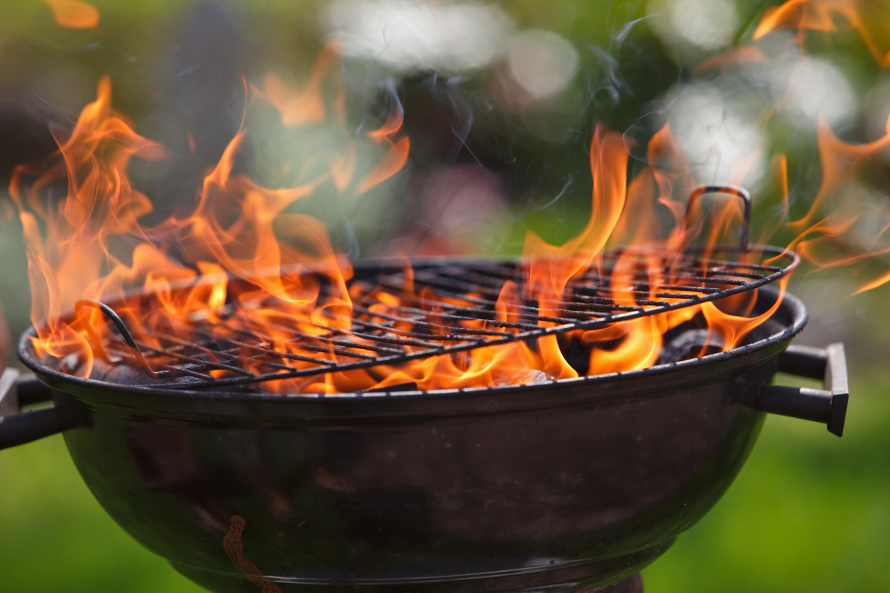 Open grill with flames coming out of it
